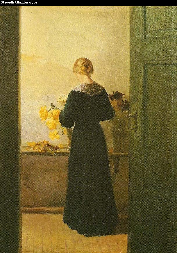 Anna Ancher en ung pige ordner blomster